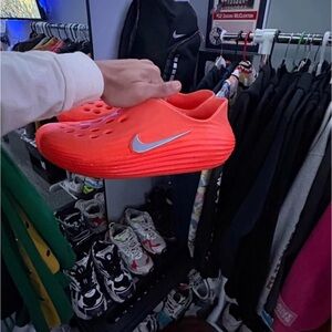 Nike Bright Orange Slip-Ons with Metallic Swoosh